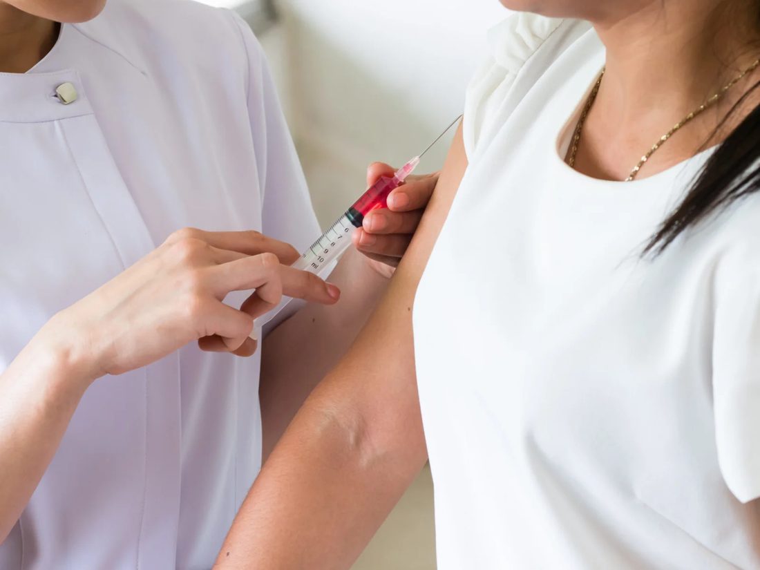 Nurse preparing a vitamin B12 injection at Elon Health Primary Care in Davenport, FL