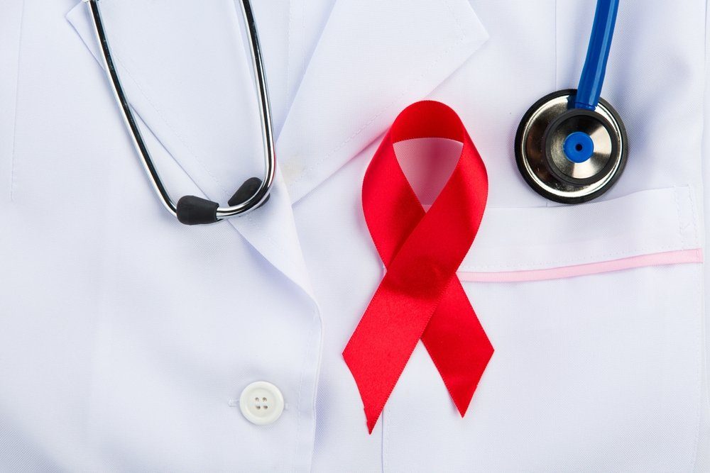 Family physician discussing confidential STD and HIV testing options with a patient in a private exam room in Davenport, FL